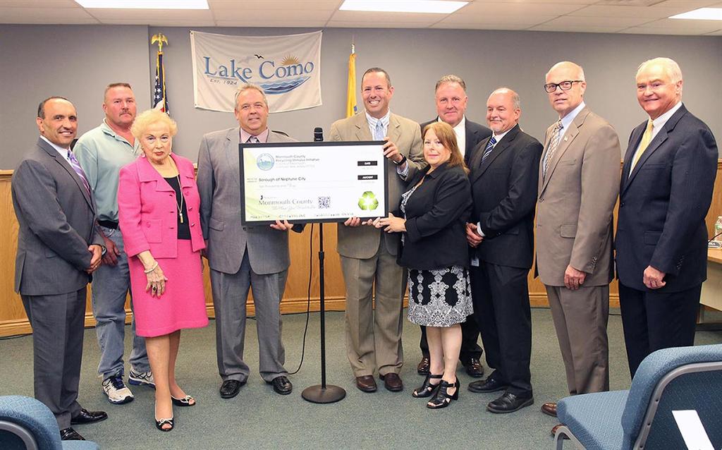 The Monmouth County Board of Chosen Freeholders and the Monmouth County Clean Communities staff presented the Borough of Neptune City with a $10,000 Recycling Stimulus Initiative Grant at the Freeholders’ regular public meeting on June 25.Pictured left to right: Freeholder Thomas A. Arnone, Recycling Coordinator Gerrit DeVos, Freeholder Lillian G. Burry, Mayor Robert Brown, Stuart Newman, William Johnson, Fran Metzger, Richard Throckmorton, Freeholder Director Gary J. Rich, Sr. and Freeholder John P. Curley.